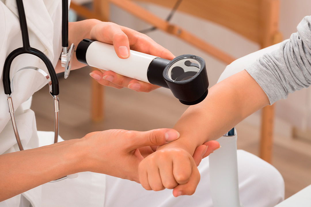 Medical skin checking by a professional over arm