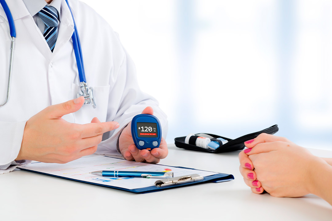 A doctor holds a blood pressure meter, emphasizing health monitoring in diabetes management in South Texas.